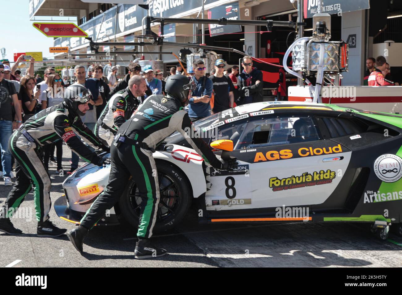 1 October 2022 - Mechanics push Lamborghini into pit garage at Festival of Speed at Circuit of Catalonia in Barcelona, Montmelo, Spain Stock Photo