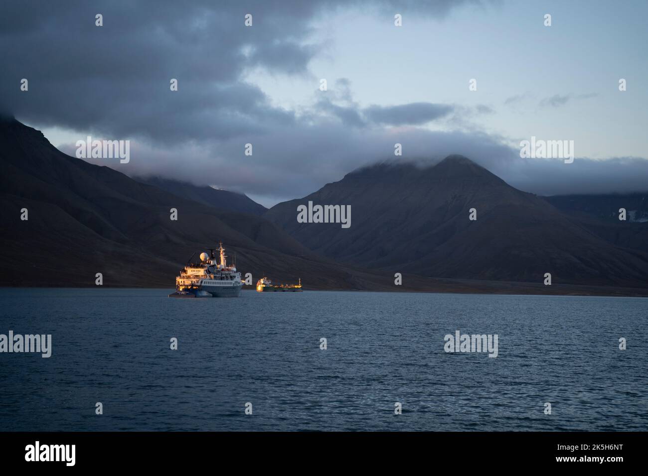 big cruise boat sailing in the arctic coast of Svalbard islands, Norway Stock Photo