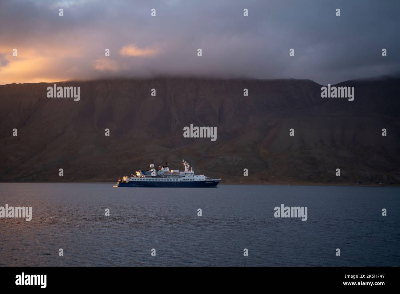 big cruise boat sailing in the arctic coast of Svalbard islands, Norway Stock Photo
