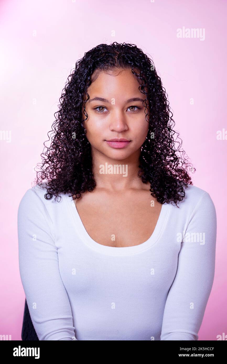 Headshot of a Young Black Actress on a Pink Background Stock Photo