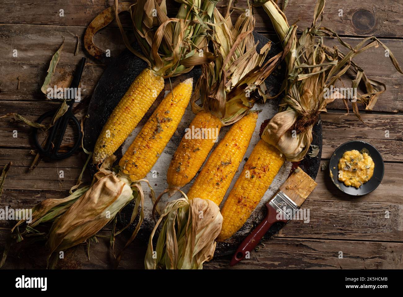roasted corn with husks Stock Photo Alamy
