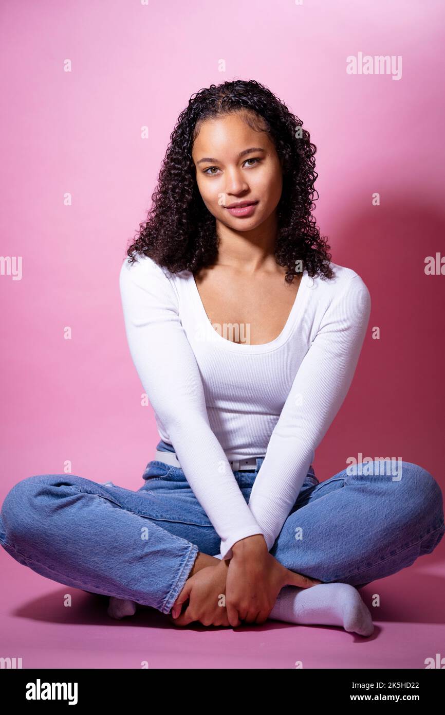 Headshot of a Young Black Actress on a Pink Background Stock Photo