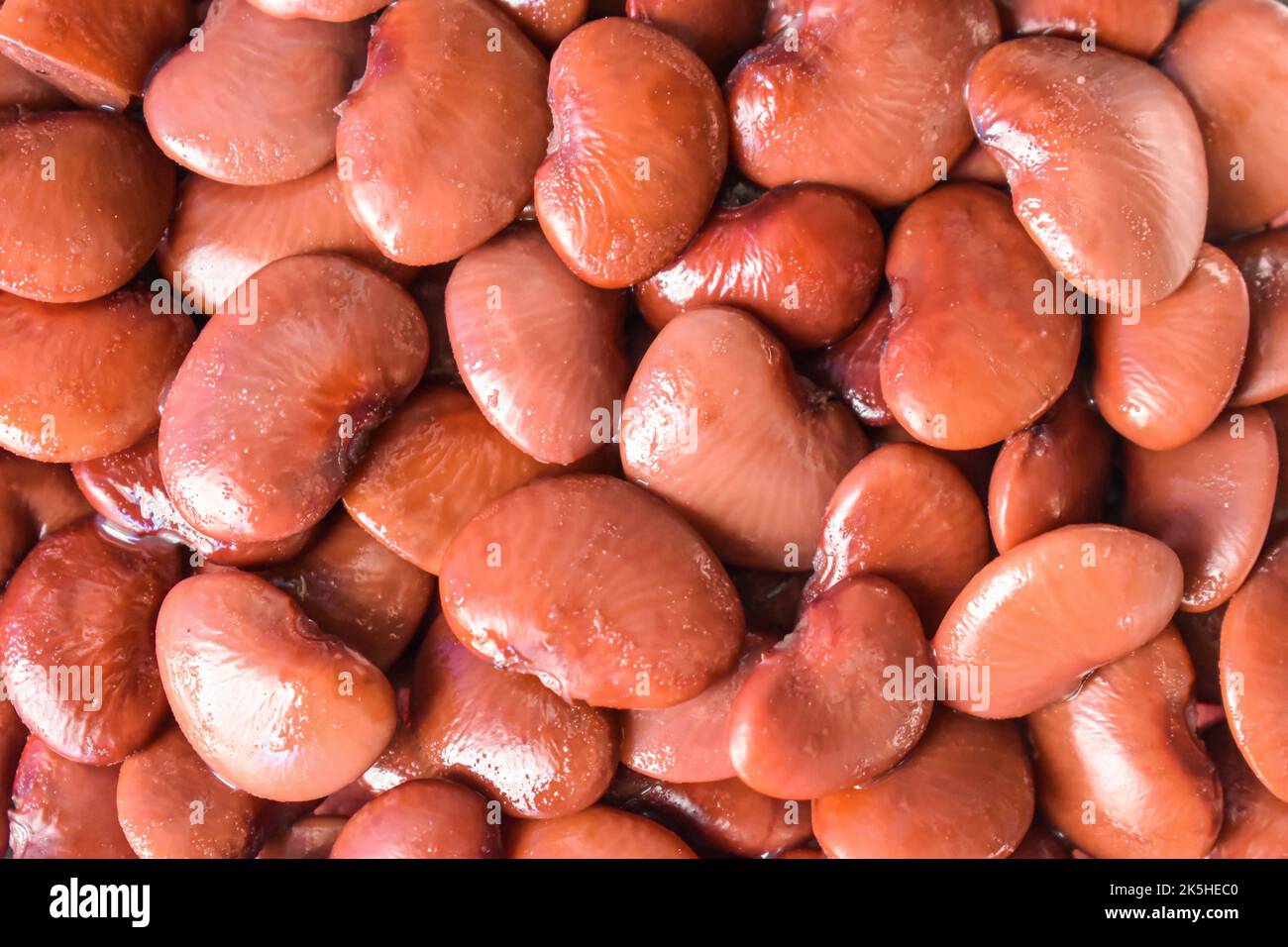 Red flat beans. Protein rich food. Healthy diet. Closeup view. Stock Photo