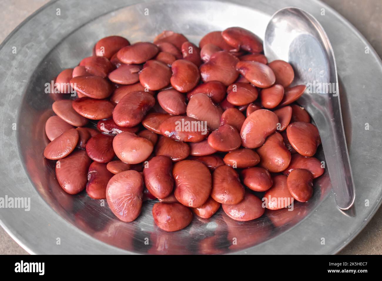 Boiled red flat beans. Protein rich food. Healthy diet menu. Closeup view. Stock Photo