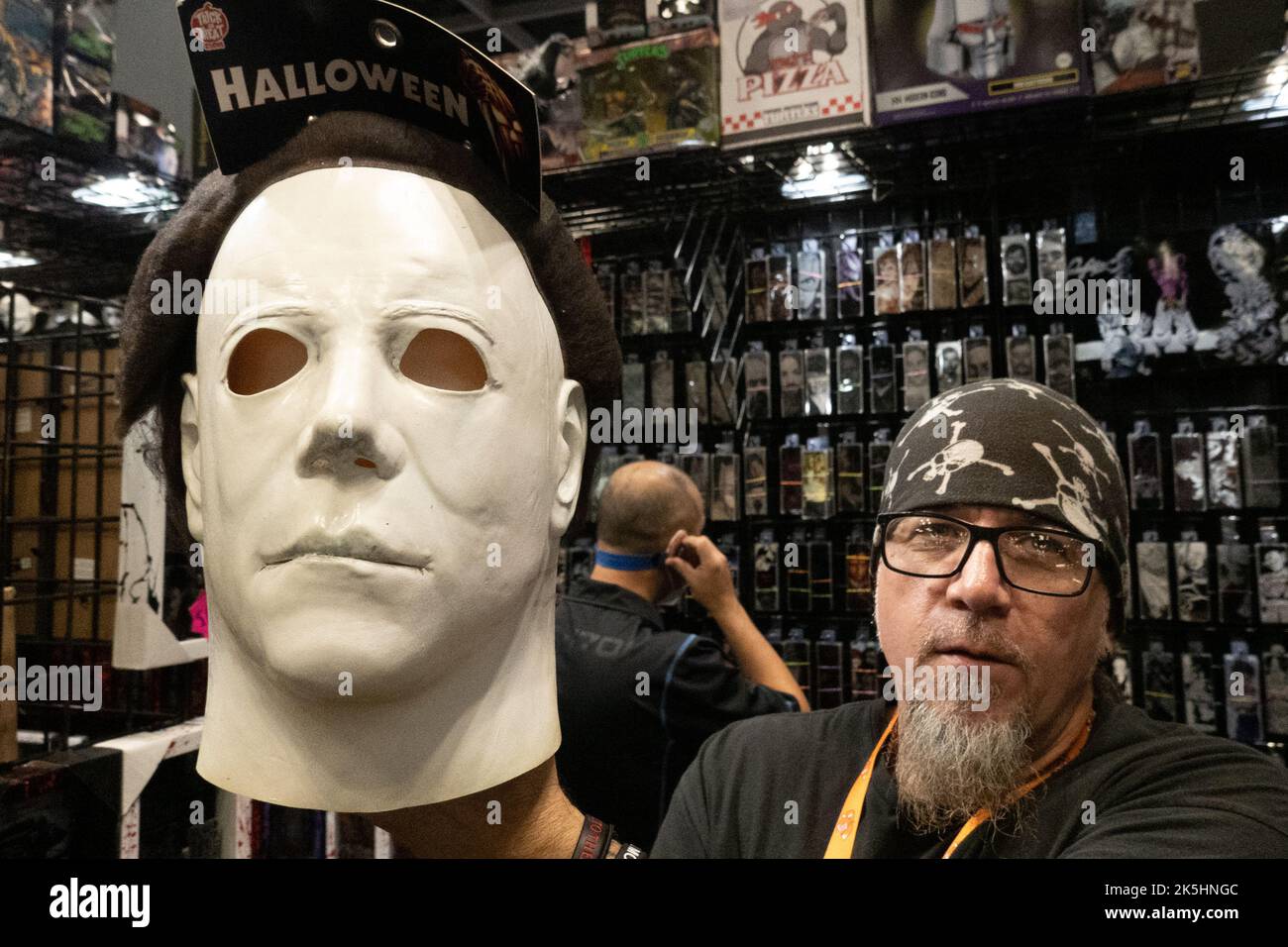 New York, NY, USA. 8th Oct, 2022. A vendor holds up a mask of Michael Myers mask from the