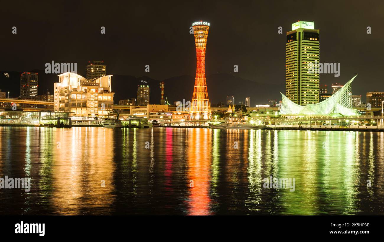 Night time shots of Kobe harbour in Kobe, Japan showing the Kobe Port Tower and the Okura Hotel. Stock Photo