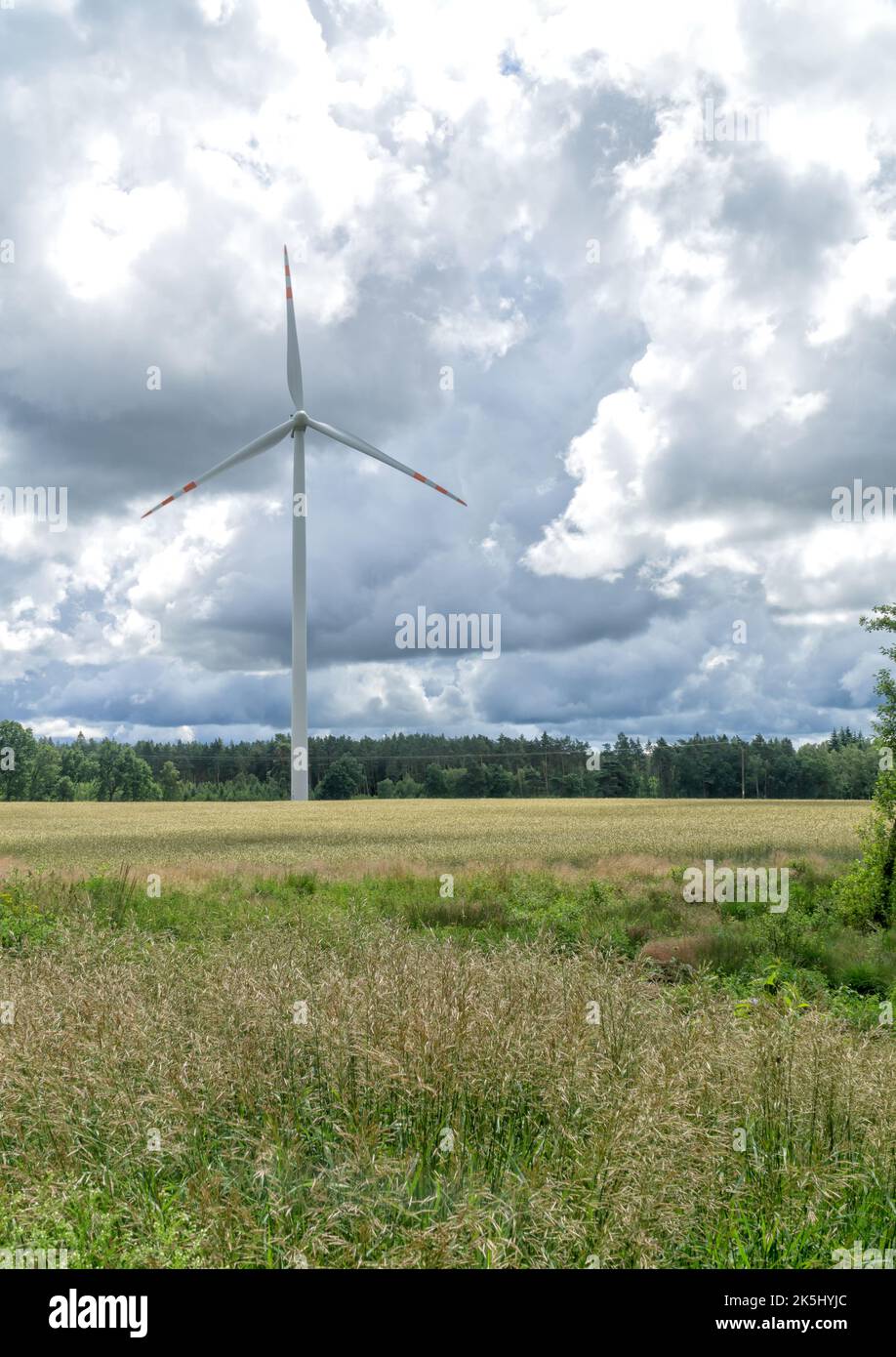 Rural landscape with wind turbine, windmill for electric power ...