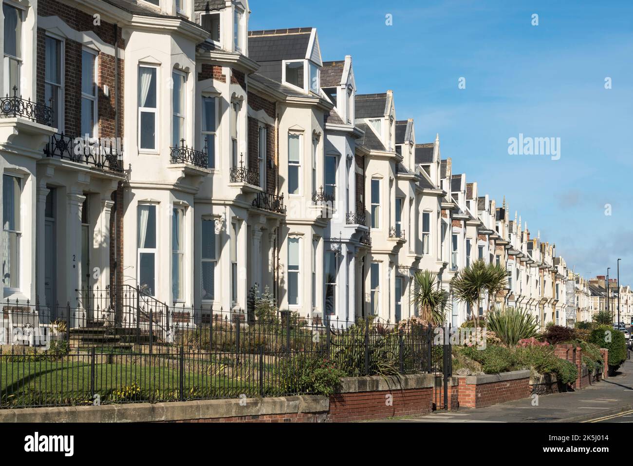 Beverley Terrace a row of seafront terraced Victorian houses in Cullercoats, Tyne and Wear, England, UK Stock Photo