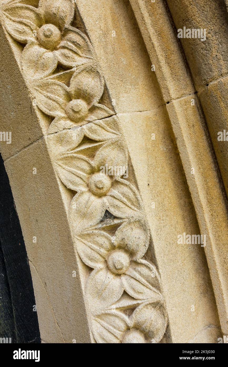 Closeup detail view of fine, decorative stone carving / stone masonry around Little Dalby Church doorway, Leicestershire, England, UK Stock Photo