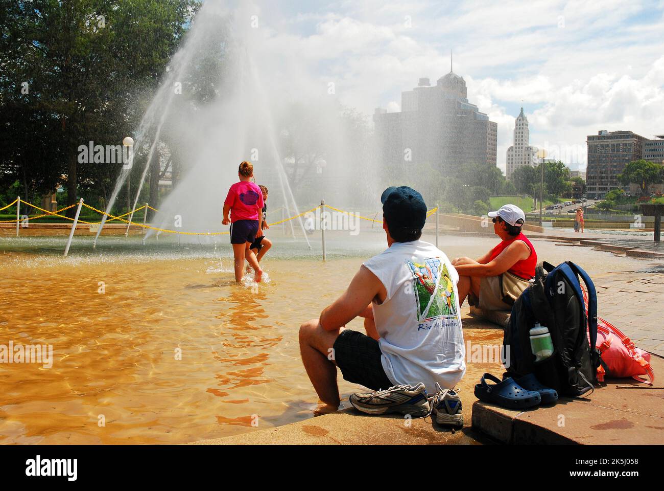 A Family Cools Off on a Hot Summer Day at a water fountain at Mud Island park in Memphis Tennessee Stock Photo