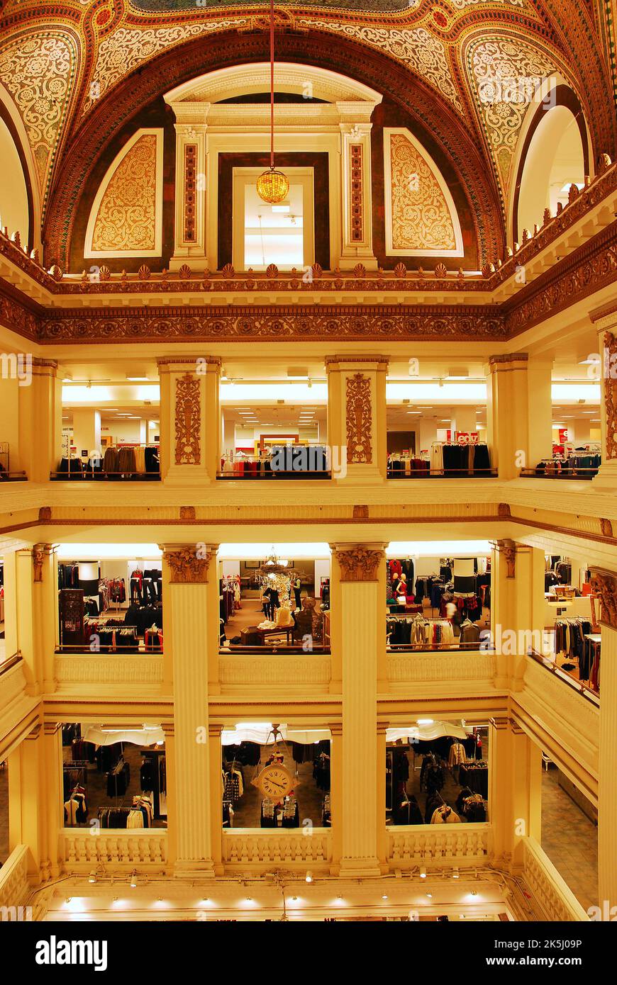 The interior  multi storied Atrium of Macys, formerly Marshall Fields Department Store in Chicago is decorated with mosaics and tiles on the walls Stock Photo