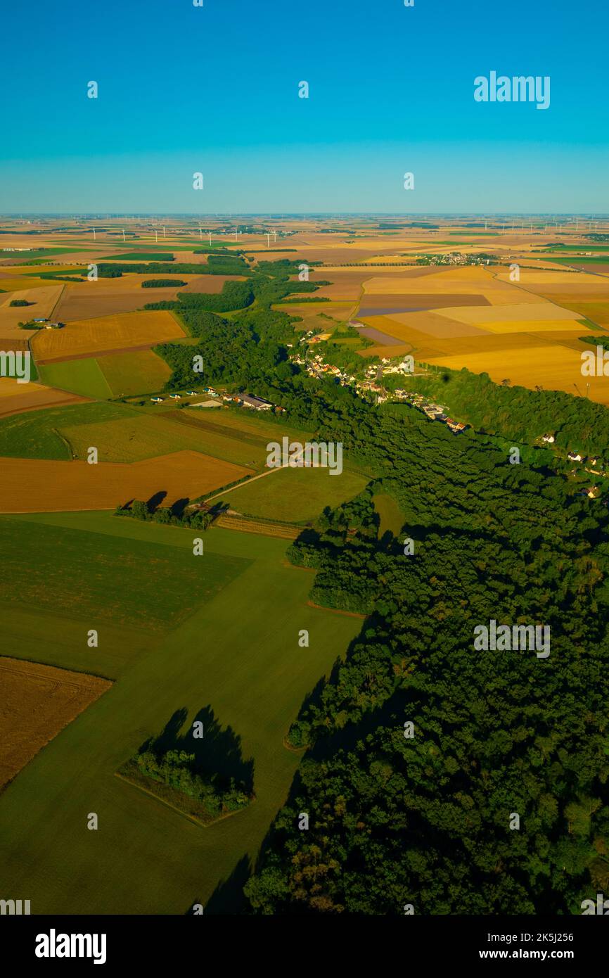 France, Essonne (91), Garsenval, aerial view of the cereal plains of the Beauce in early summer before the harvest and the forest valley of the Marett Stock Photo