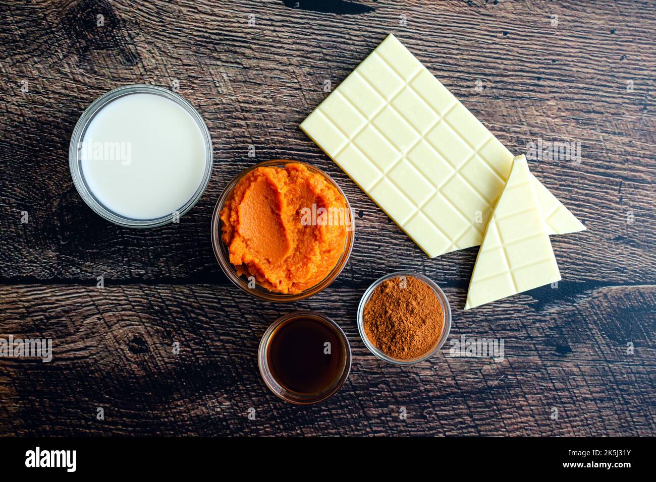 Pumpkin Spice Hot Chocolate Ingredients: Pureed pumpkin, white chocolate, and other ingredients viewed from above Stock Photo
