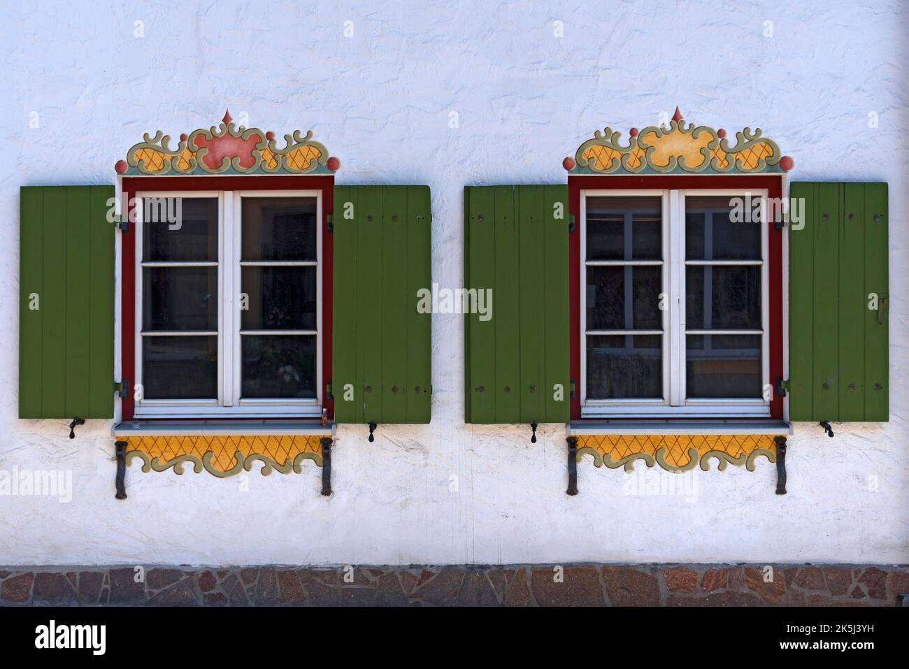 Decorative windows with shutters, Nesselwang (Ostallgaeu), Bavaria, Germany Stock Photo
