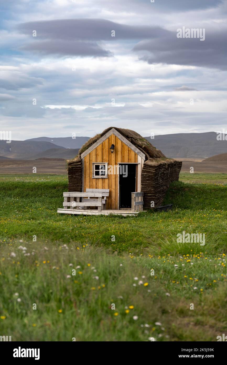Small traditional wooden peat house with grass on the roof, Moeorudalur