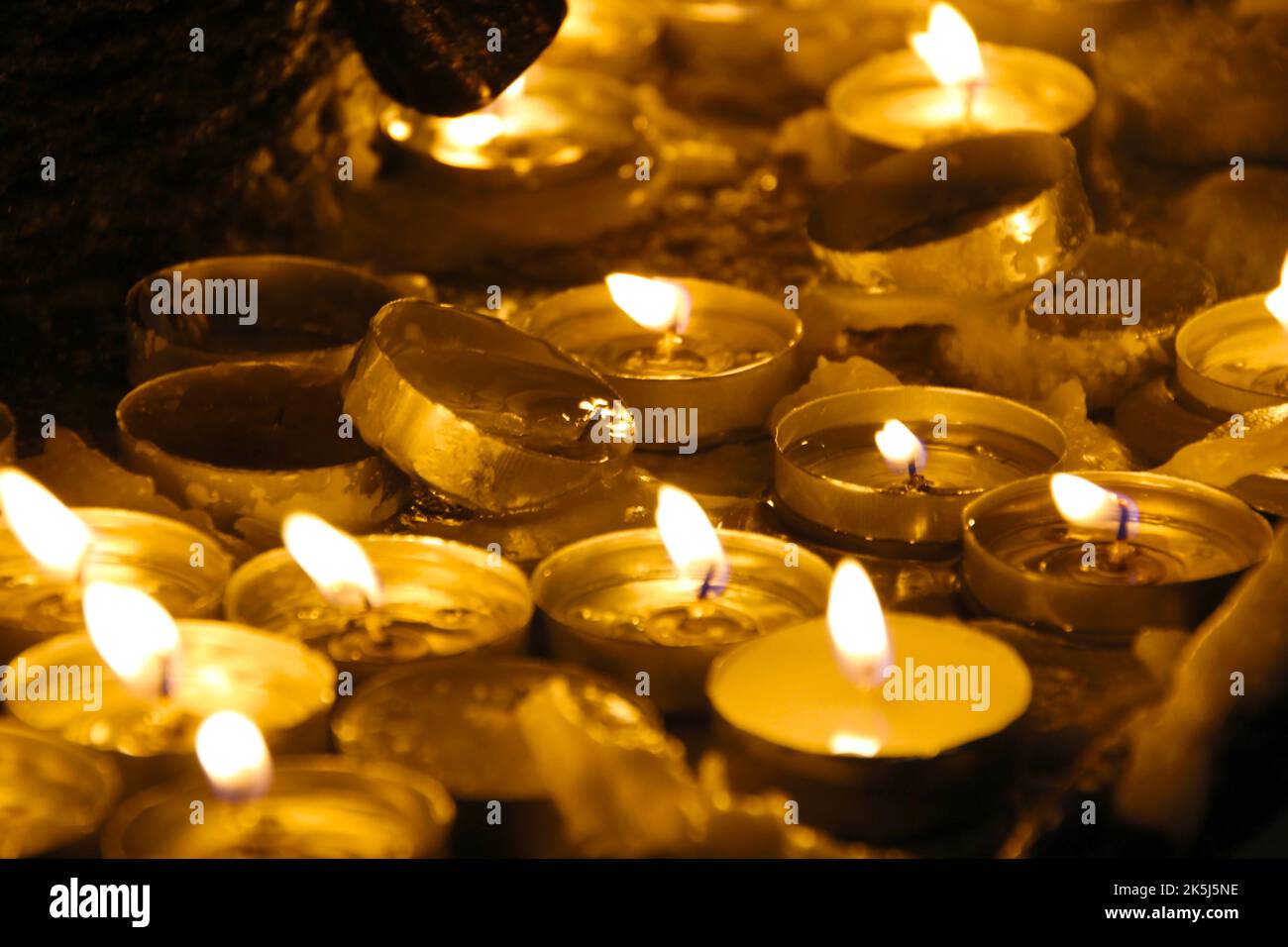 Closeup image of a group of burning candles, religious, sanctuary