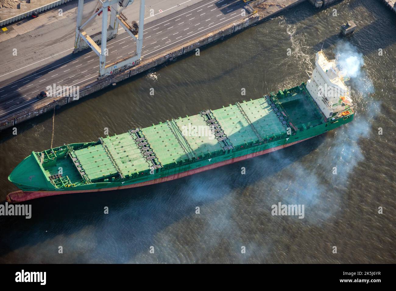 Aerial view of a cargo ship in the port of Hamburg with a lot of exhaust gas, emissions, smoke, Hamburg, Germany Stock Photo
