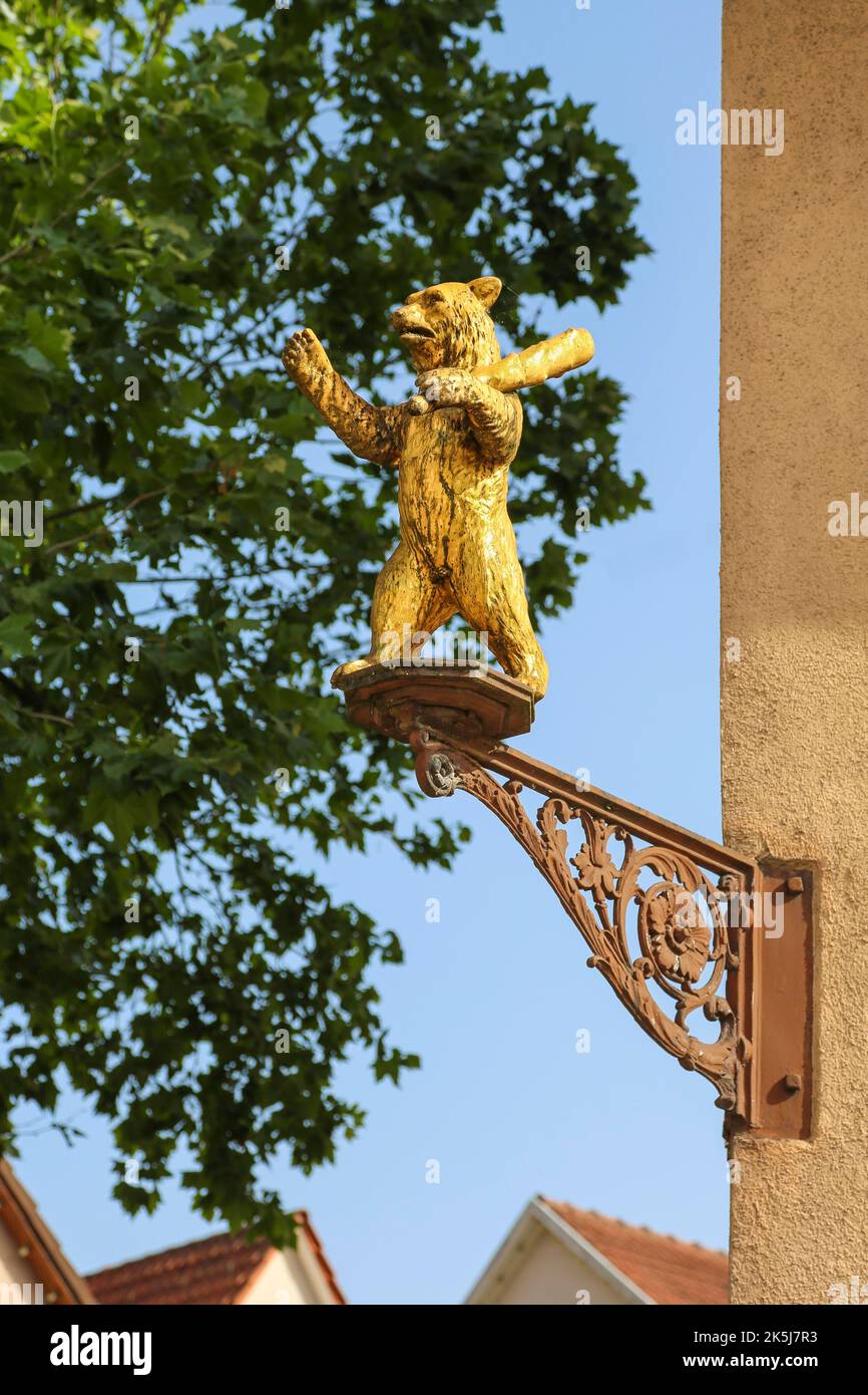 Golden bear figure on facade, former Gasthof Baeren, inn, restaurant, sculpture, plastic, Eningen unter Achalm, Baden-Wuerttemberg, Germany Stock Photo