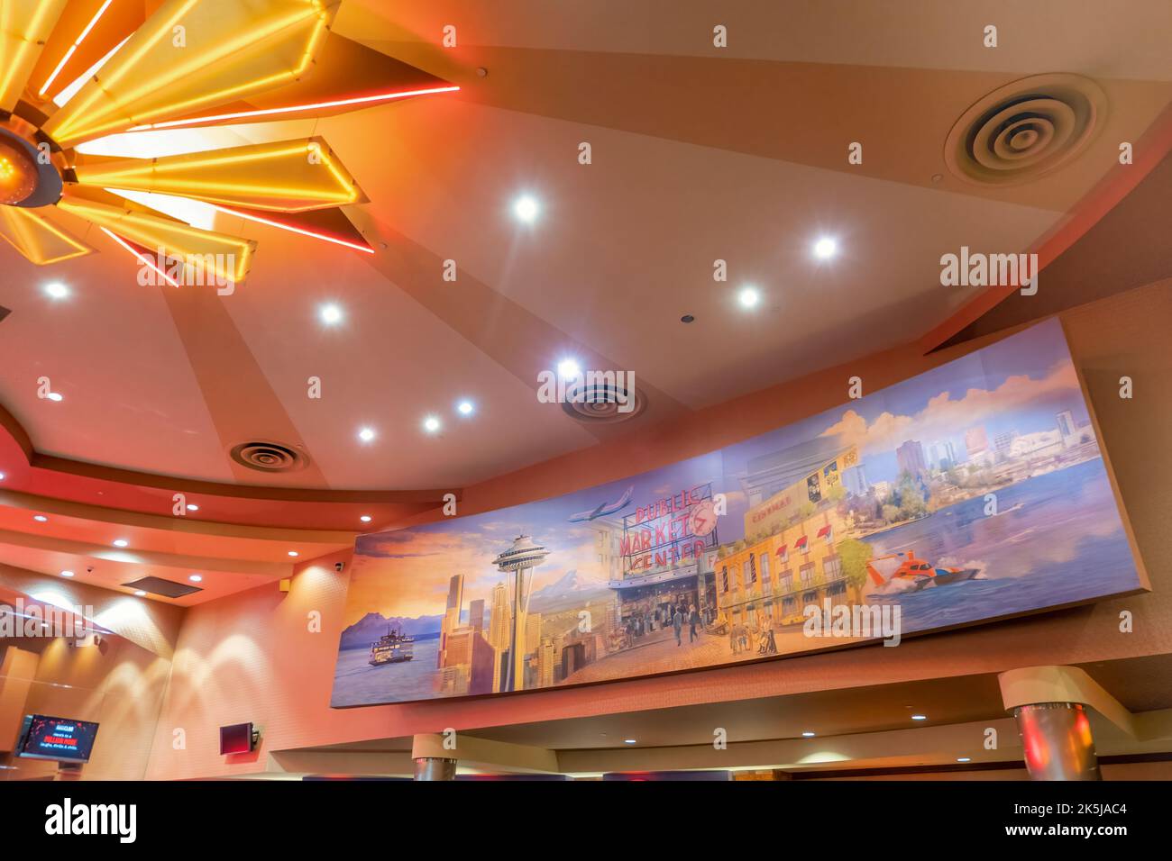 The movie theater lobby displaying a panoramic mural of Seattle in the Lincoln Square Mall located in Bellevue, Washington. Stock Photo