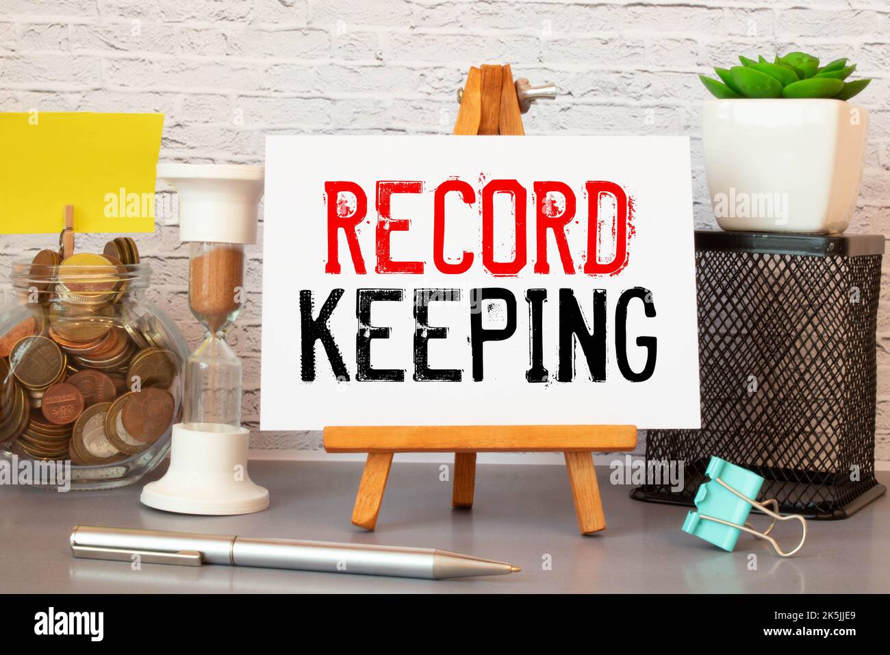 Word text RECORD KEEPING on white paper. Stock Photo