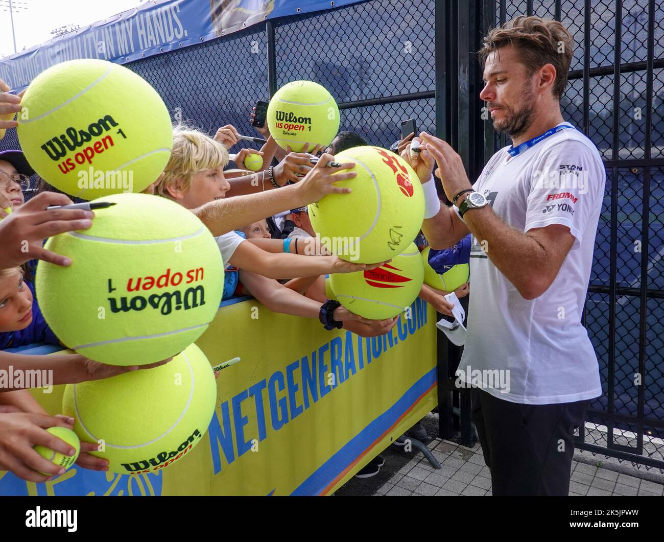 Grand Slam Champion Stan Wawrinka of Switzerland signs autographs after