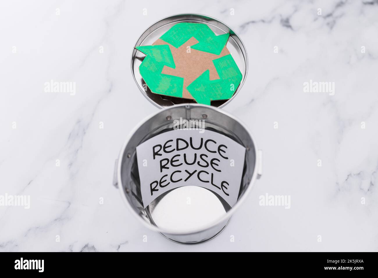 reduce reuse recycle sign with mini trash can and recycle icon, concept