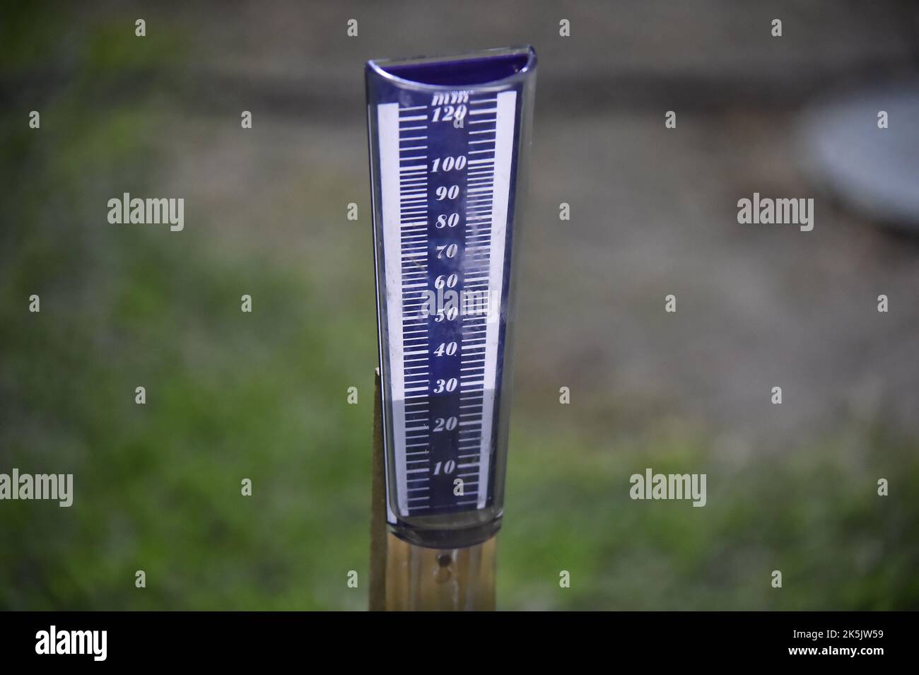 device to measure the amount of rainfall on the ground Stock Photo Alamy