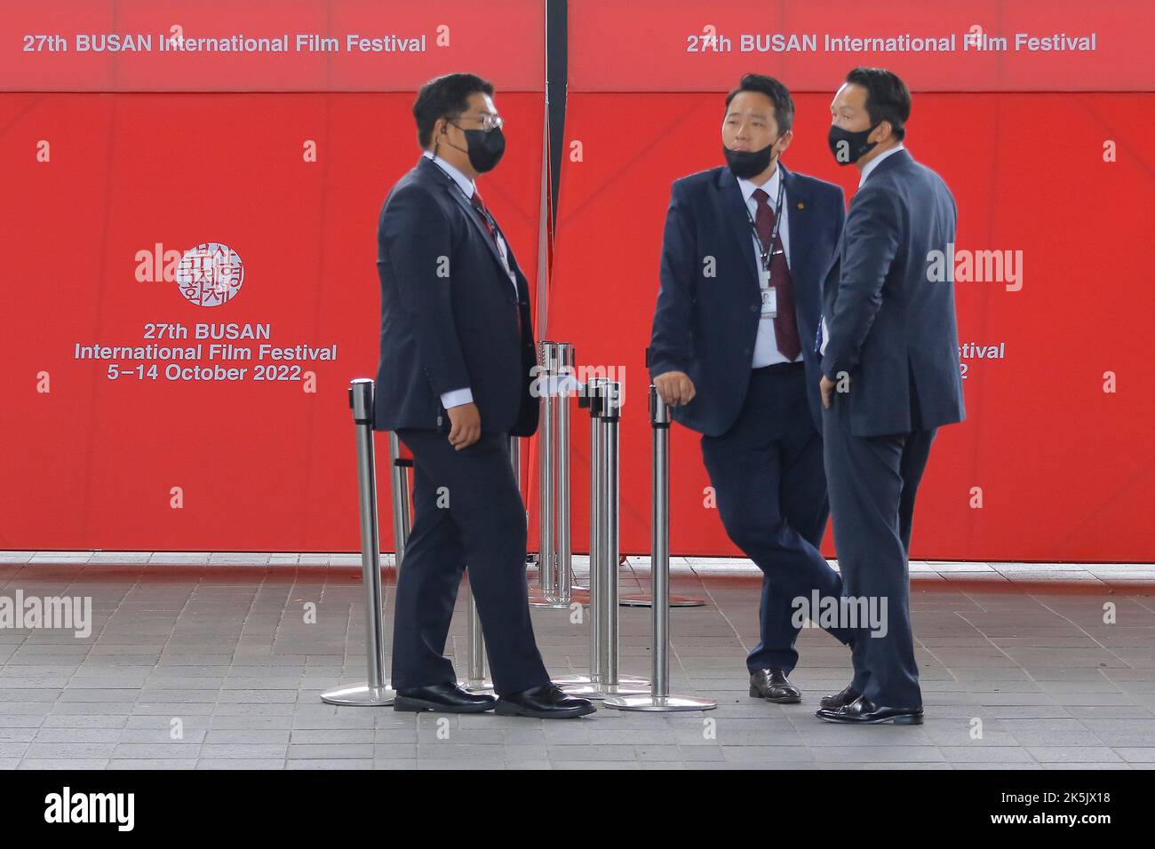 Oct 5, 2022-Busan, South Korea-Security Guards stand by for work for the 27th Busan international film festival at cinema square in Busan, South Korea. Stock Photo