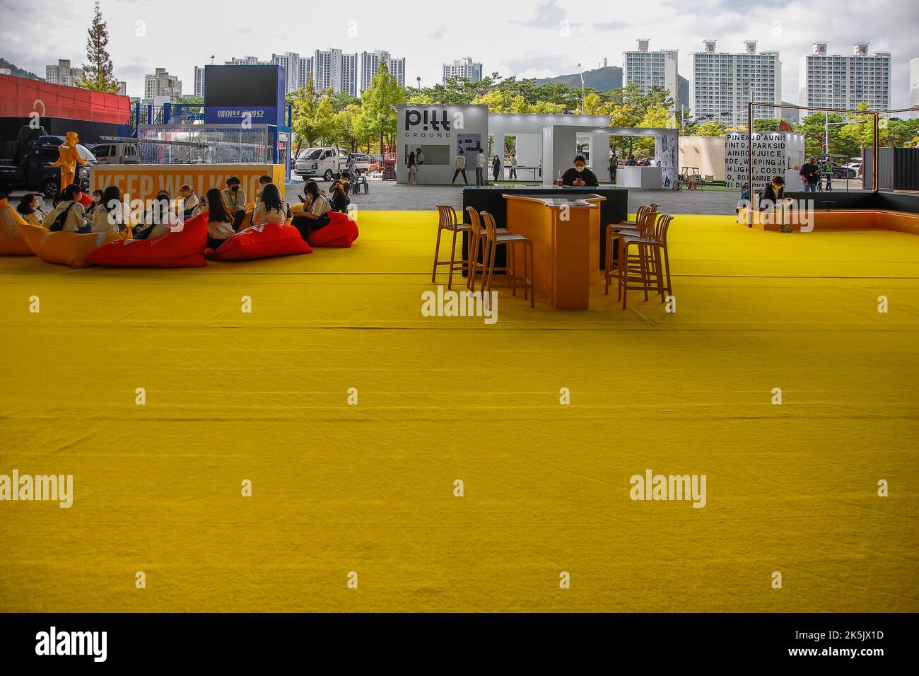 Oct 5, 2022-Busan, South Korea-Volunteers stand by work  for the 27th Busan international film festival at cinema square in Busan, South Korea. Stock Photo