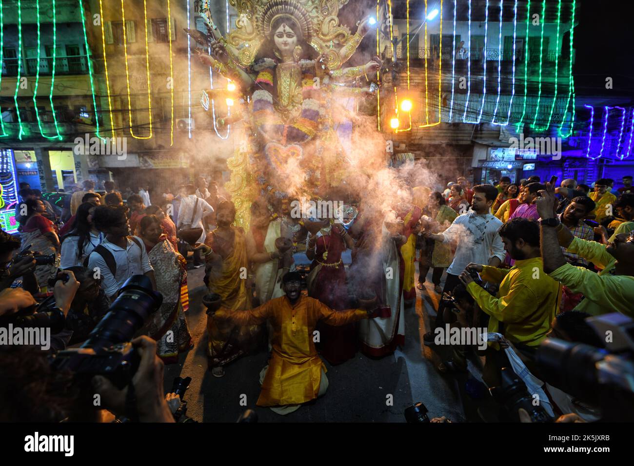 Kolkata, India. 06th Oct, 2022. Hindu devotees perform rituals during the immersion procession of Durga Puja at Bagbazar. Vijaya Dashami is the last day of the 10 days long Durgapuja Festival in India. Credit: SOPA Images Limited/Alamy Live News Stock Photo