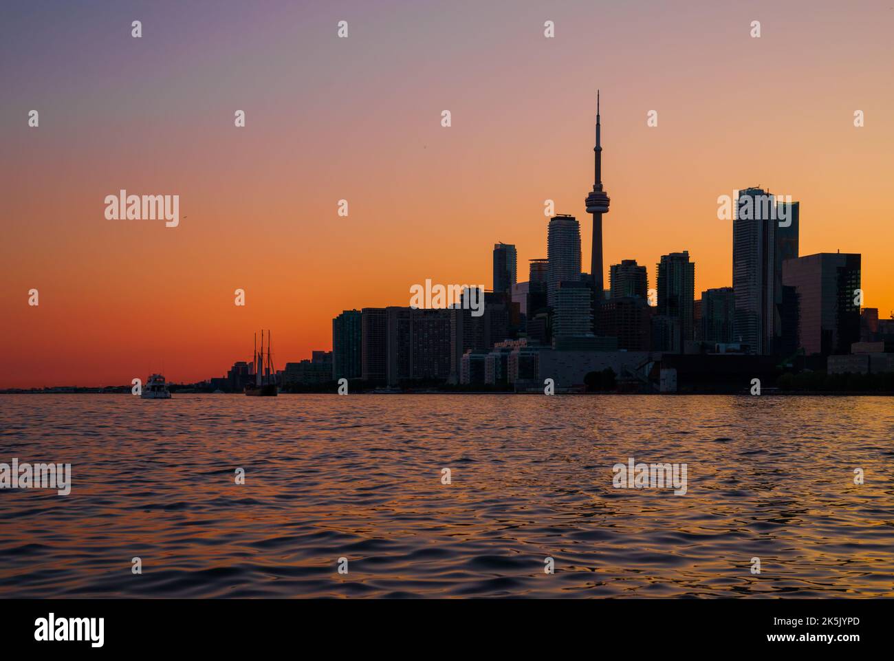 Toronto downtown cityscape with skyscrapers, white yacht, old sail ship ...
