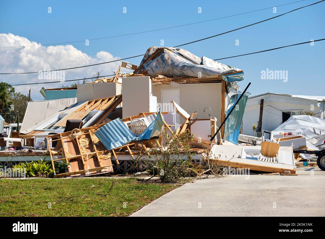 Severely damaged house after hurricane Ian in Florida mobile home
