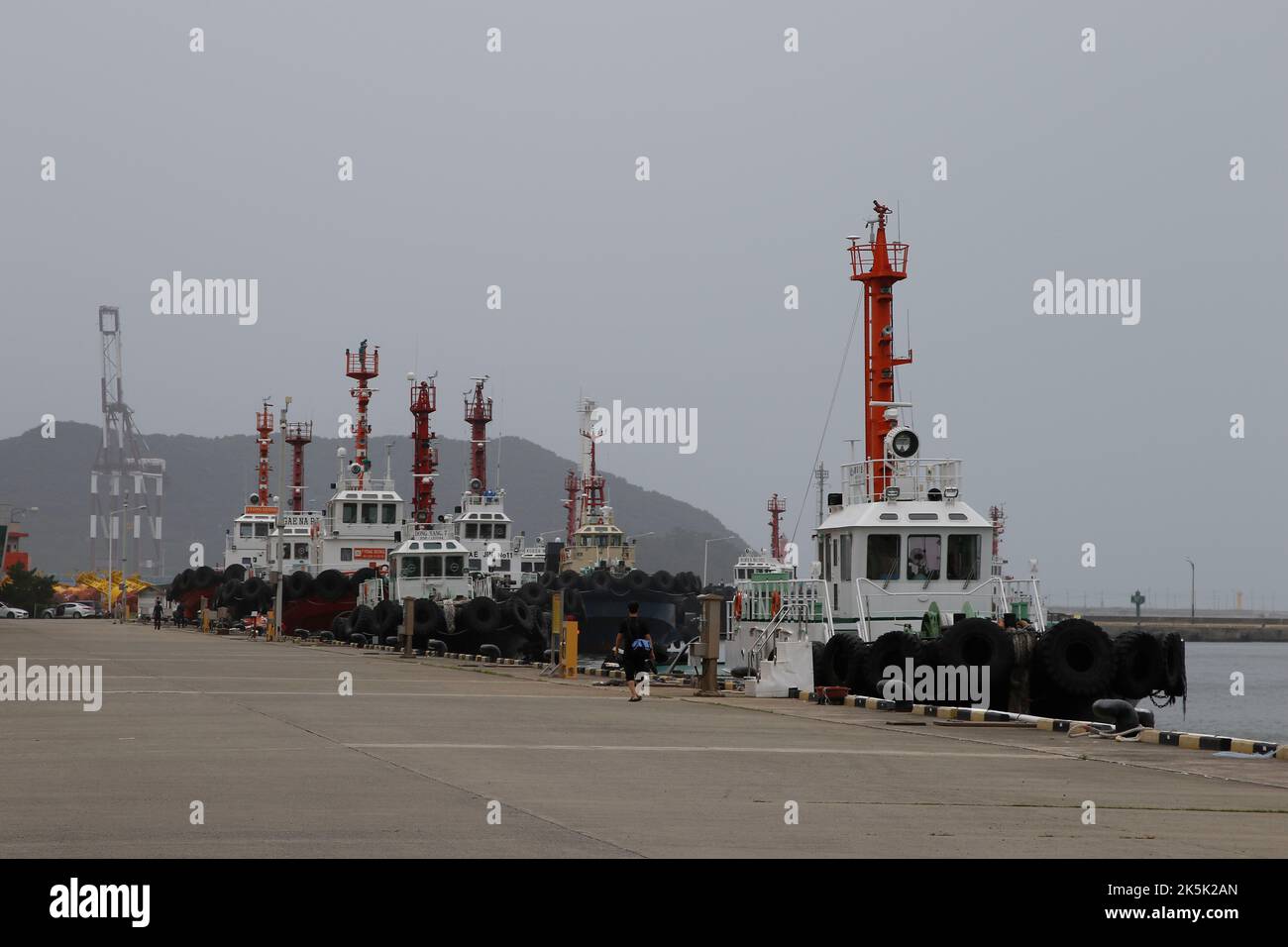 Sep 5, 2022-Busan, South Korea-Tugboat anchored safe zone at New port in Busan, South Korea. Super Typhoon Hinnamnor has gradually moved northward to reach waters off the southern island of Jeju on Monday, the state weather agency said, as South Korea braces for what could be the most powerful storm ever to hit the country. Stock Photo