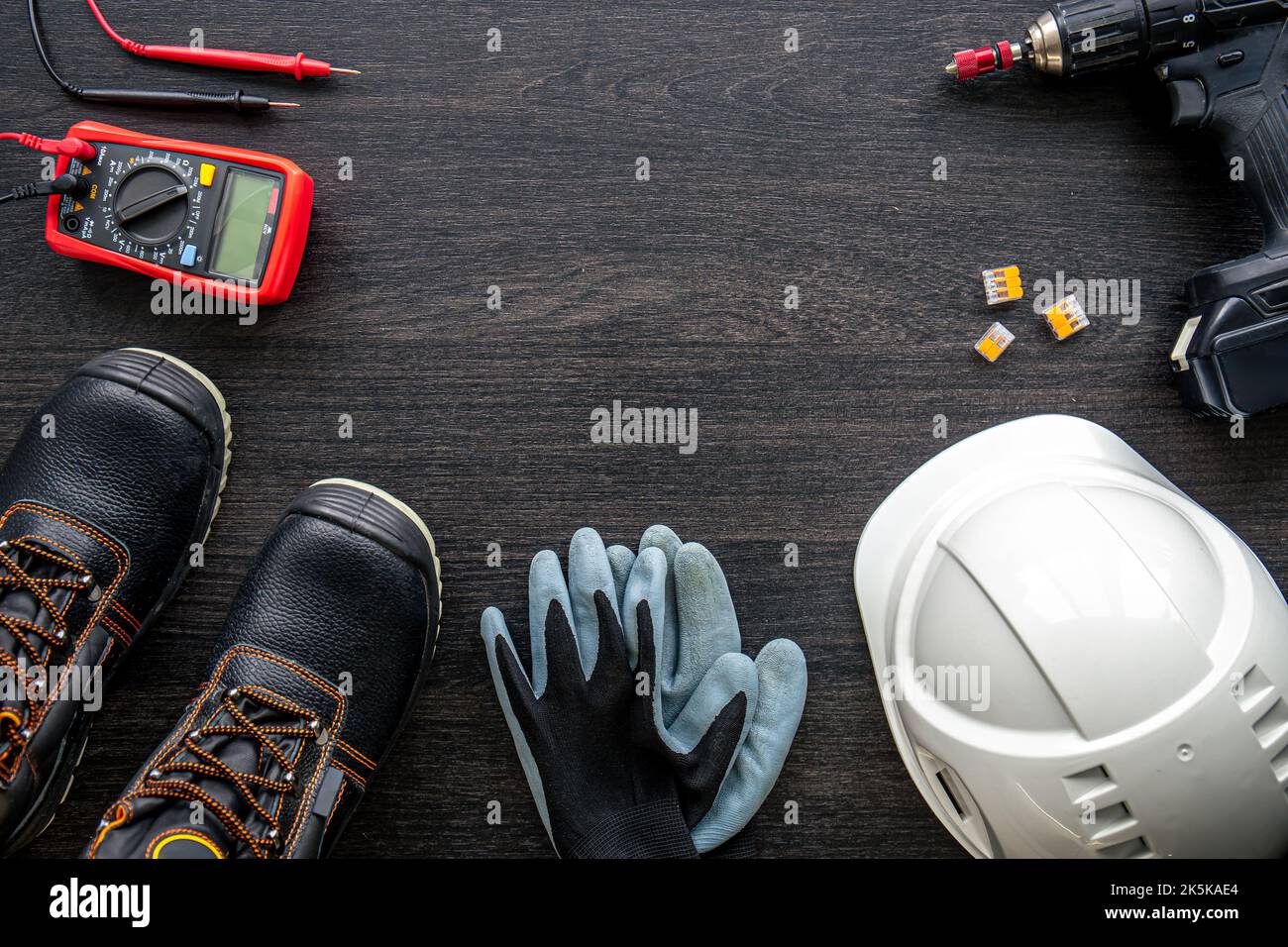 Different electrical tools on wooden background, flat lay. Stock Photo