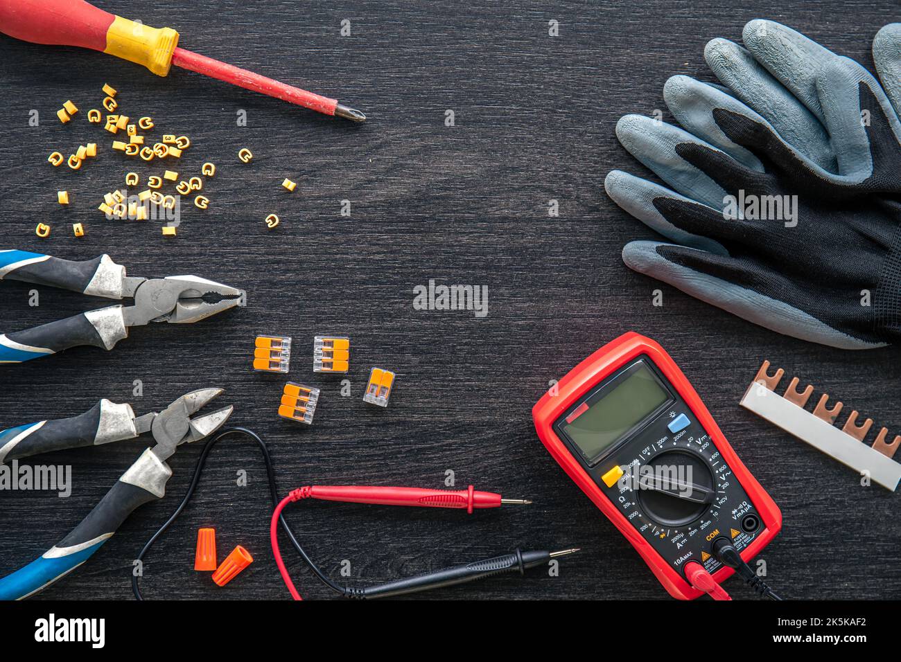 Different electrical tools on wooden background, flat lay. Stock Photo