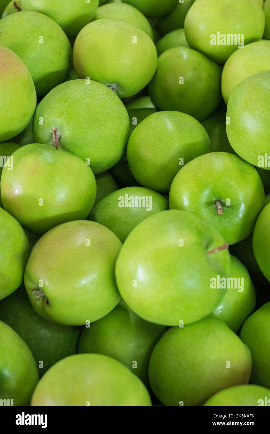 Fresh organic Ripe green apples box on wooden table Stock Photo by