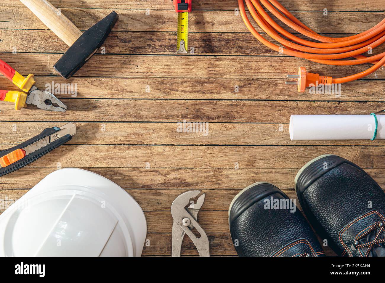 Flat lay composition with different construction tools on wooden background. Stock Photo