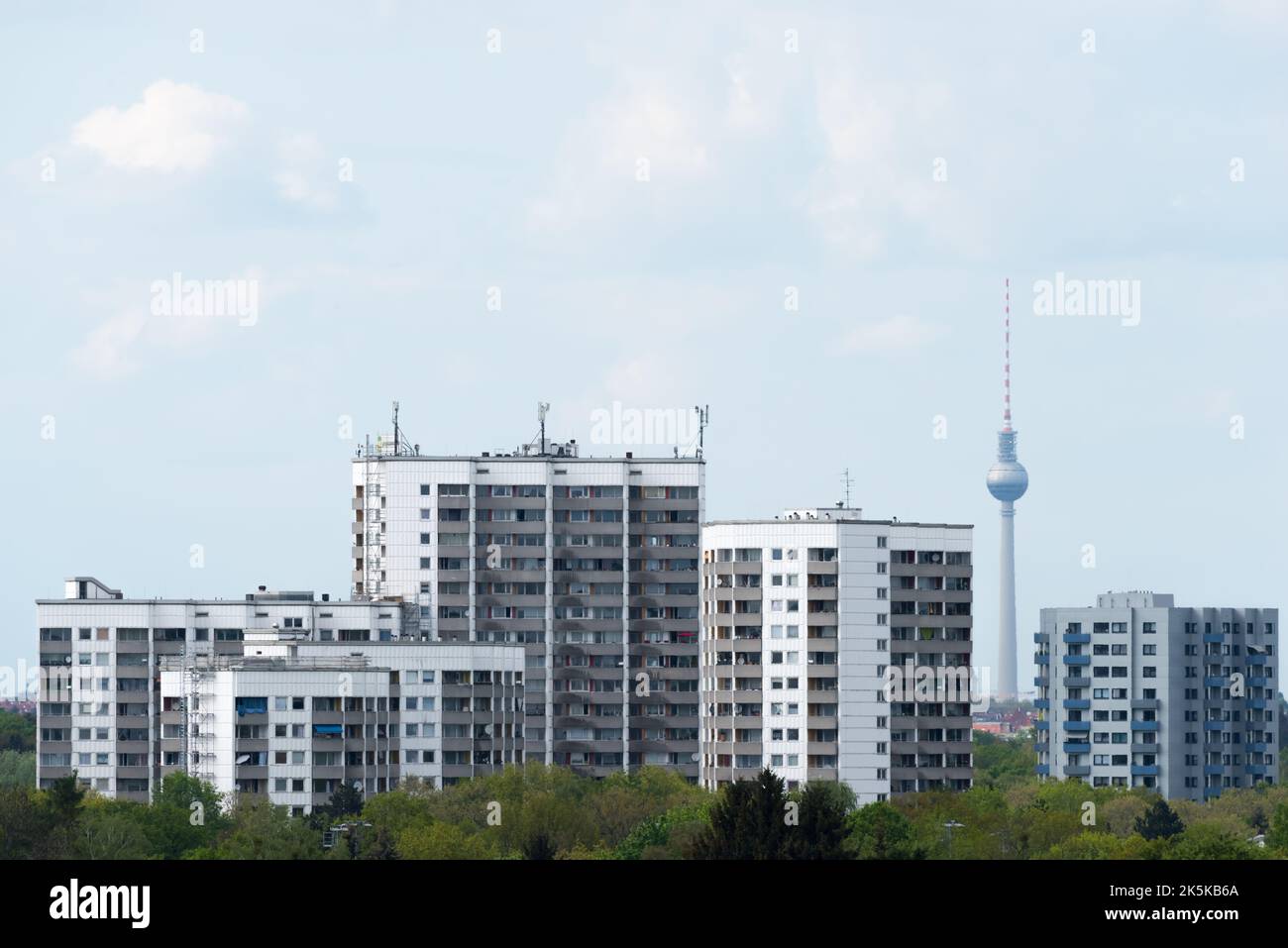 Prefabricated high-rise buildings in Gropiusstadt with the Berlin TV tower Stock Photo