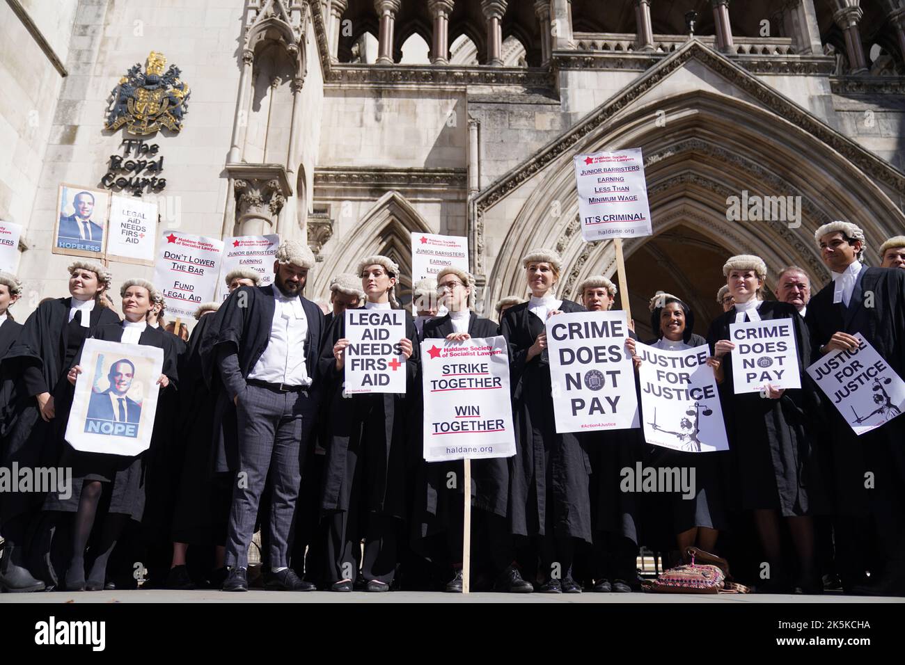 File photo dated 04/07/22 of criminal defence barristers outside the Royal Courts of Justice in London supporting the ongoing Criminal Bar Association (CBA) action over Government set fees for legal aid advocacy work. Barristers are voting on whether to end strike action after a pay offer from the Government. A ballot for Criminal Bar Association (CBA) members opened on Tuesday evening and closes at midnight on Sunday. Issue date: Sunday October 9, 2022. Stock Photo