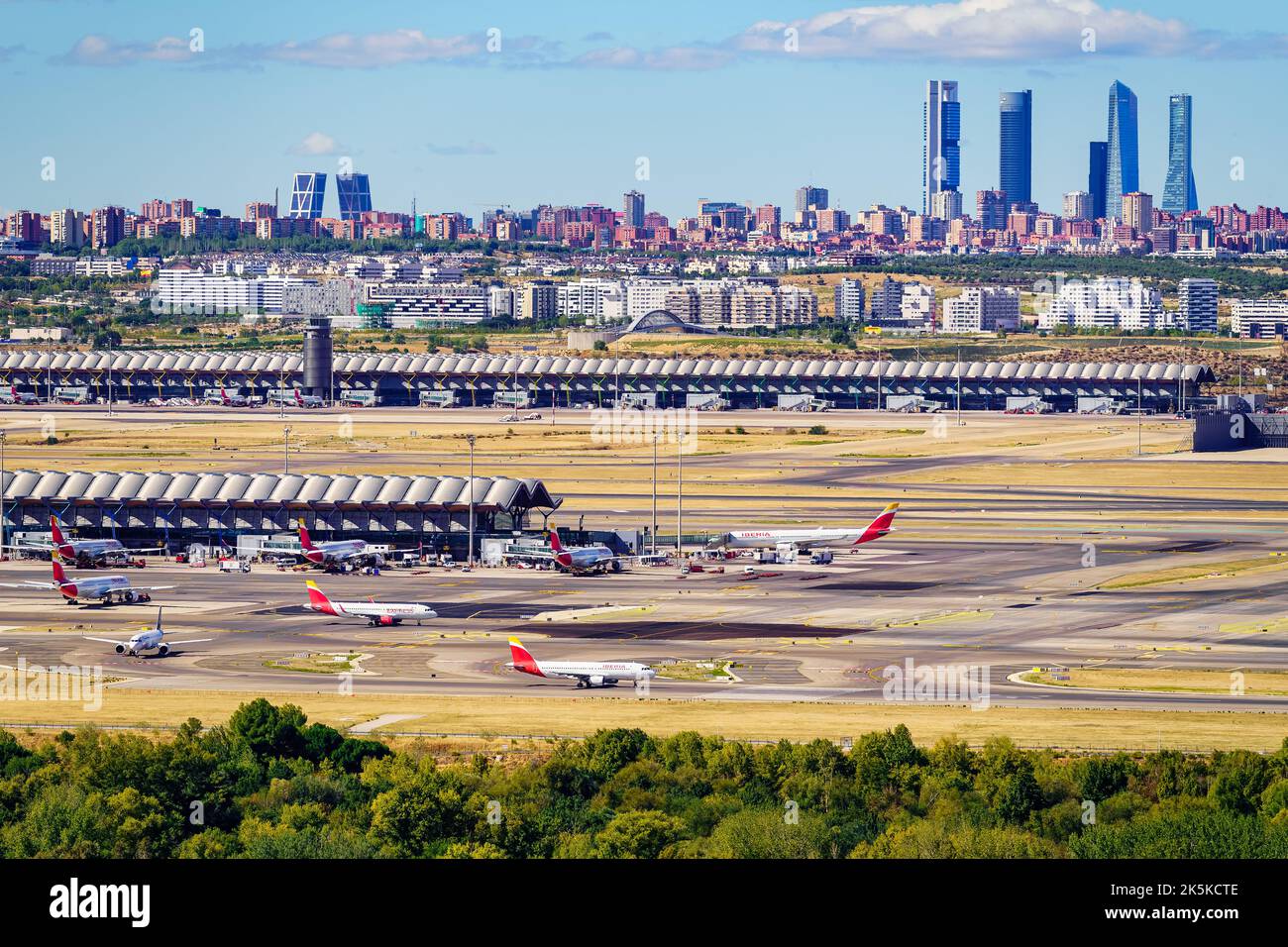 Madrid, Spain, October 30, 2022: Panoramic view of Barajas Madrid airport with the city in the background and the buildings of the financial district. Stock Photo