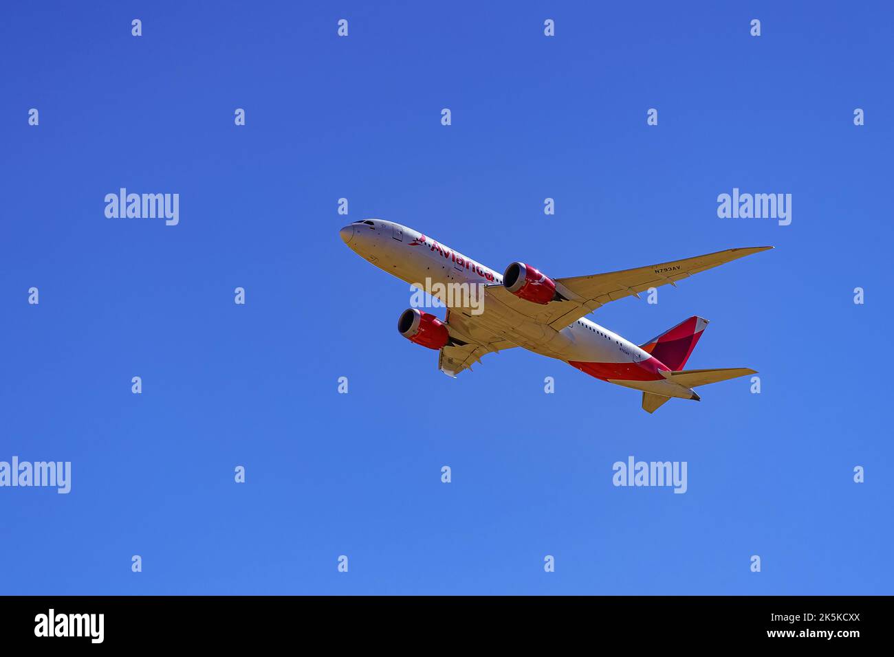 Madrid, Spain, October 30, 2022: Large plane of the Avianca airline seen from below and flying over the city. Stock Photo