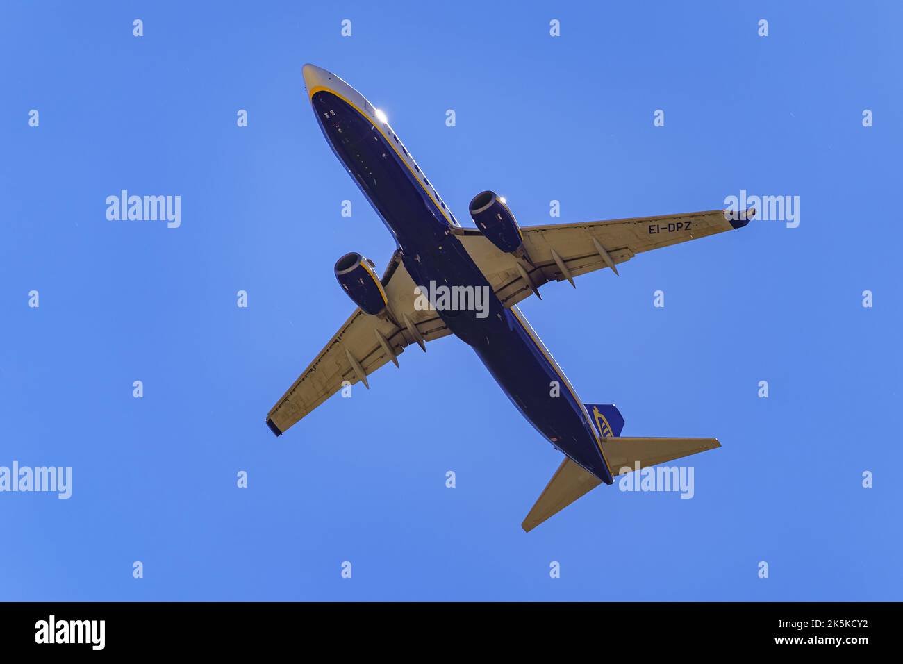 Madrid, Spain, October 30, 2022: Large plane of the Ryanair airline seen from below and flying over the city. Stock Photo