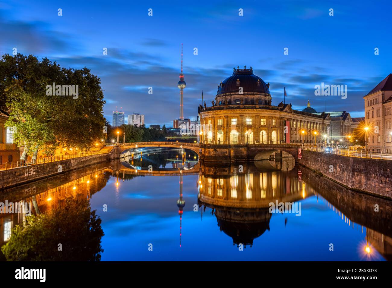 The Bode-Museum and the Television Tower reflected in the river Spree in Berlin at night Stock Photo