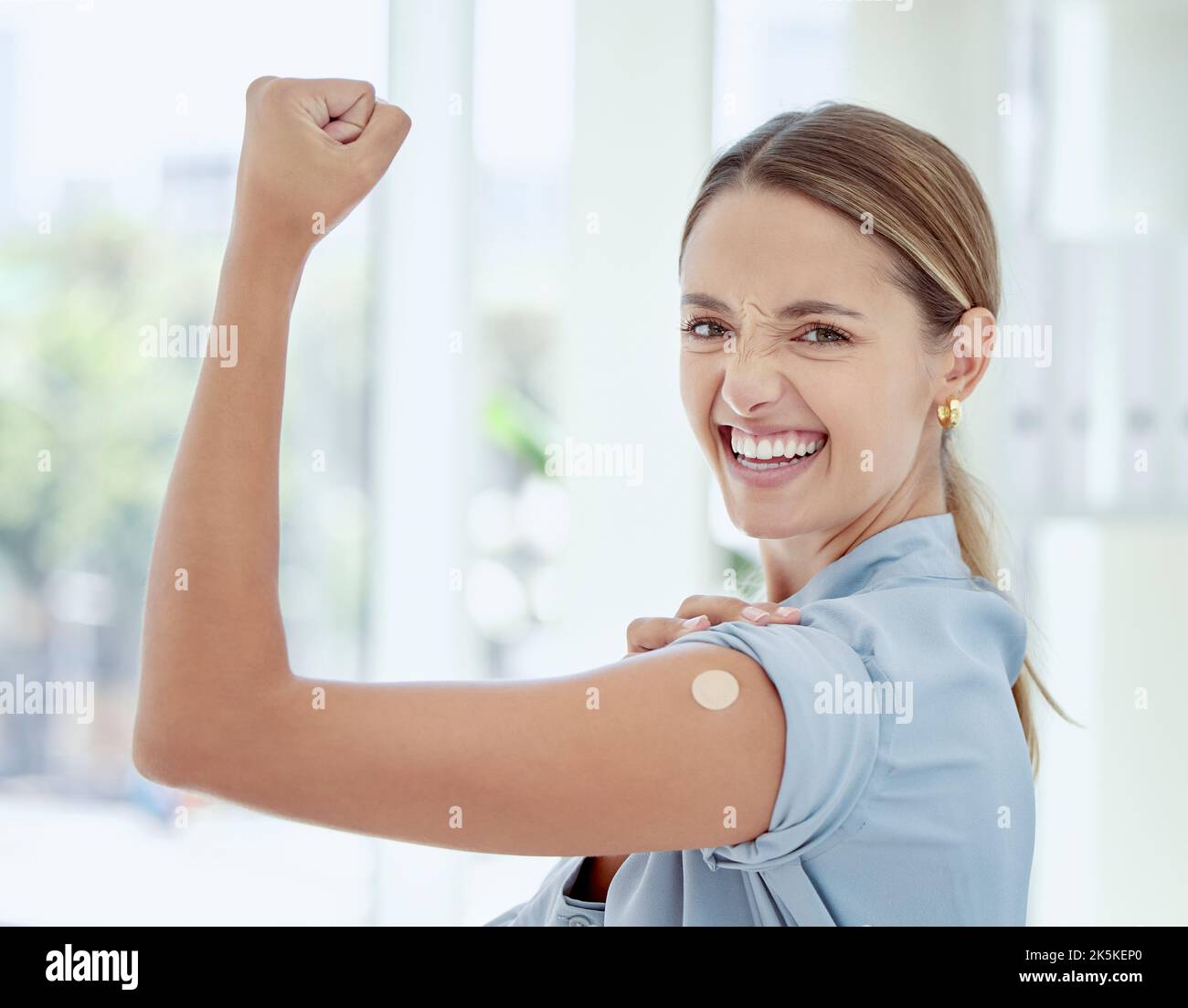 Woman, covid vaccine or band aid on flex arm in power, strength or support of Australian hospital injection. Happy smile portrait of patient and Stock Photo