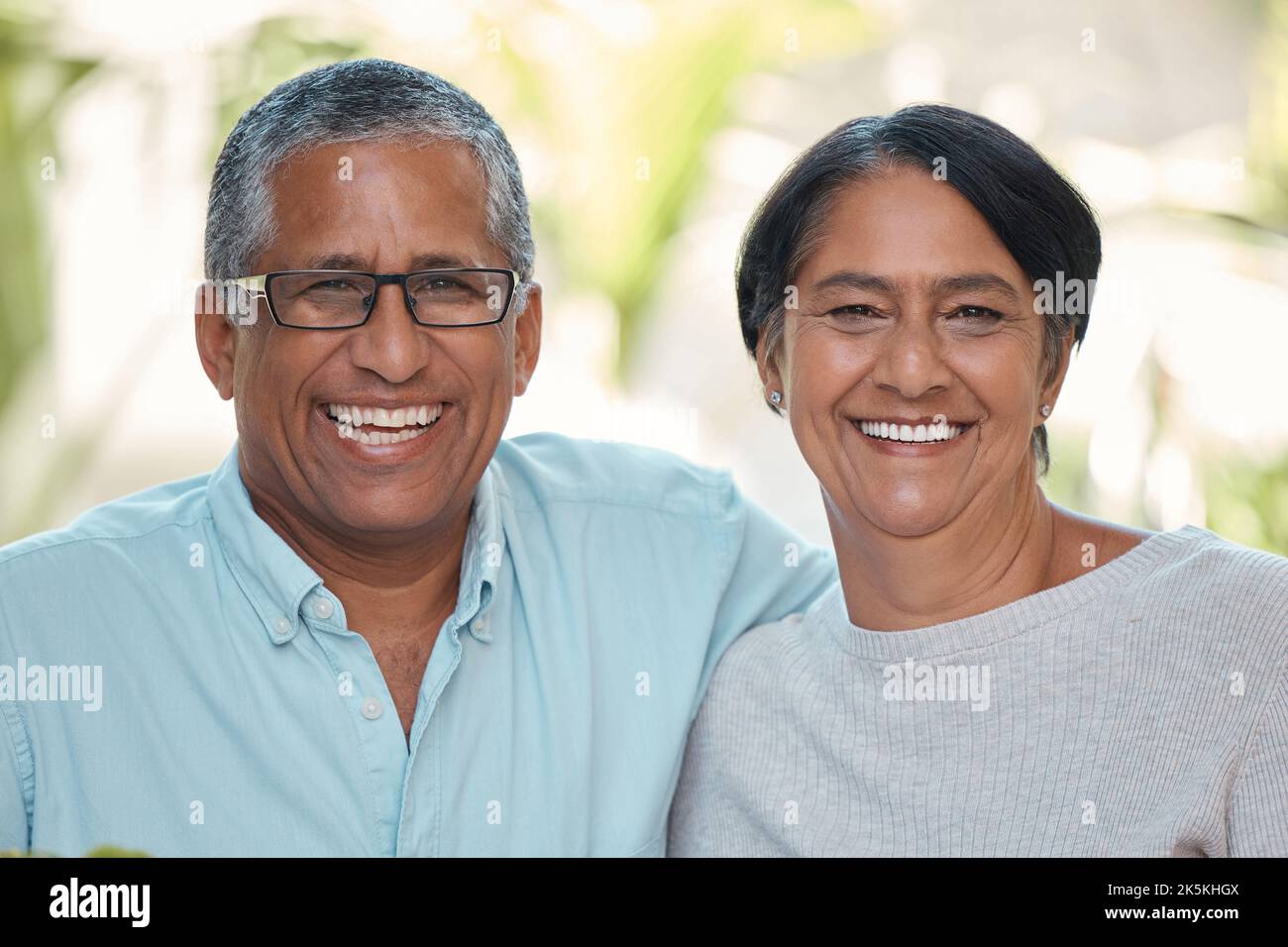 Smile, happy or bonding mature couple in house or home garden in trust, security and love marriage. Portrait of retirement, elderly or senior man and Stock Photo