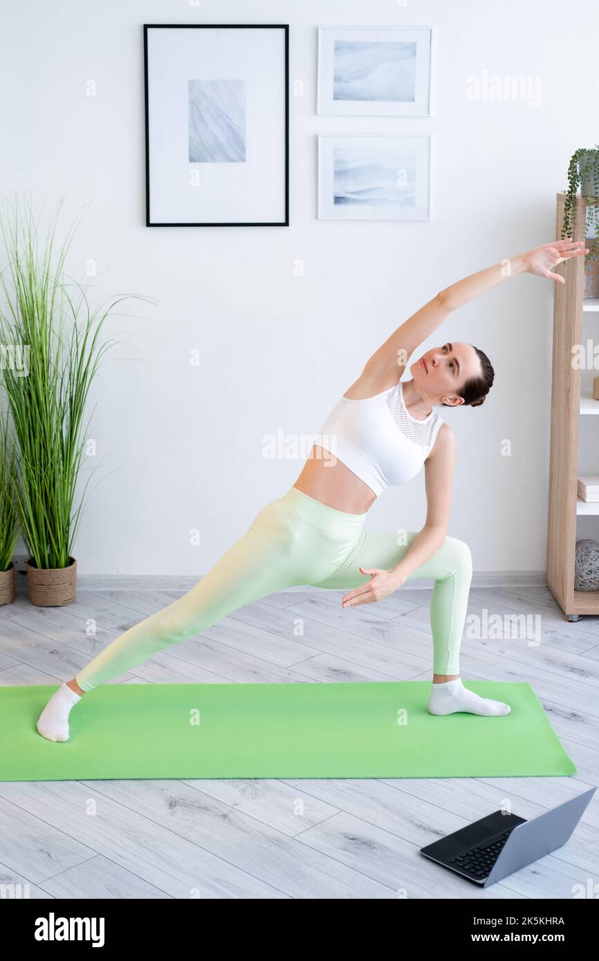home fitness training online workout woman yoga Stock Photo