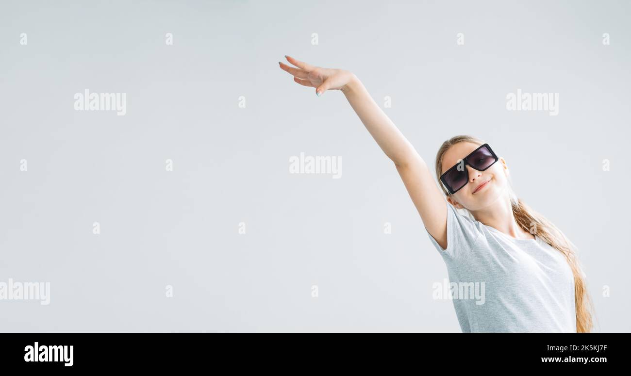 active kid advertising banner girl in sunglasses Stock Photo