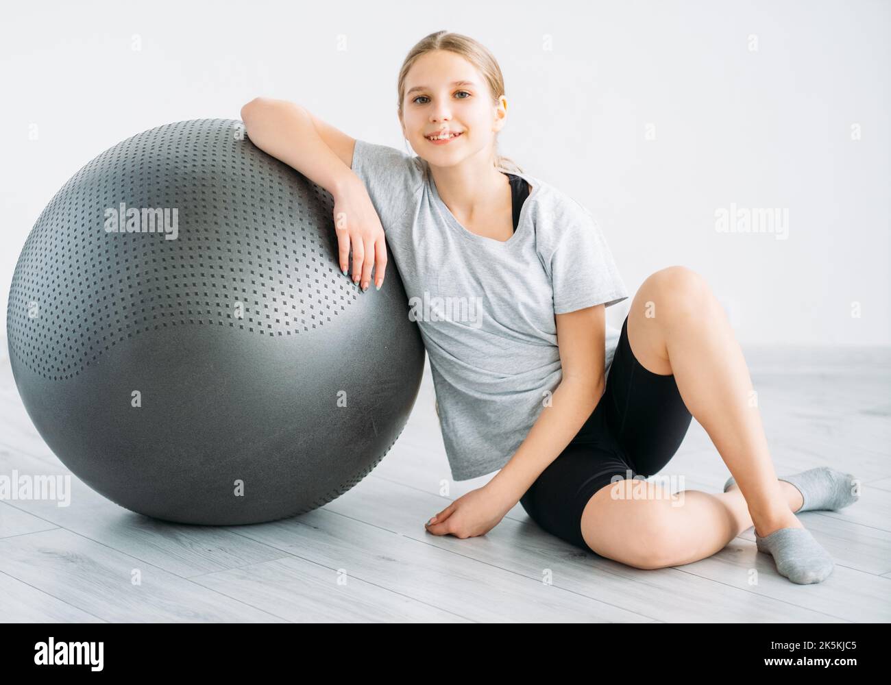 fitness equipment sport indoors girl with gym ball Stock Photo