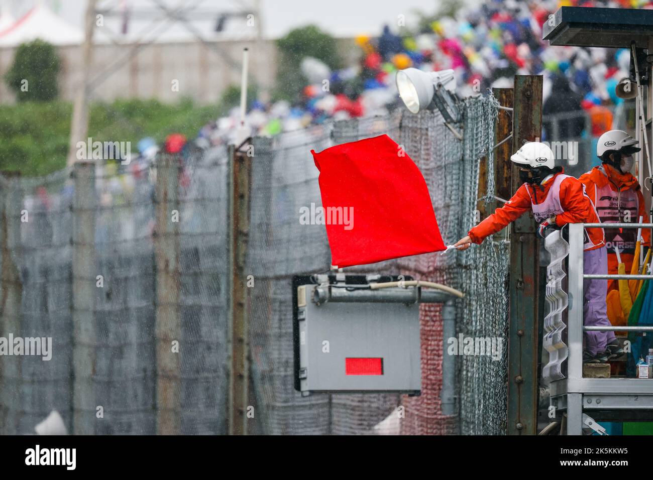red-flag-waved-by-a-marshal-during-the-formula-1-honda-japanese-grand