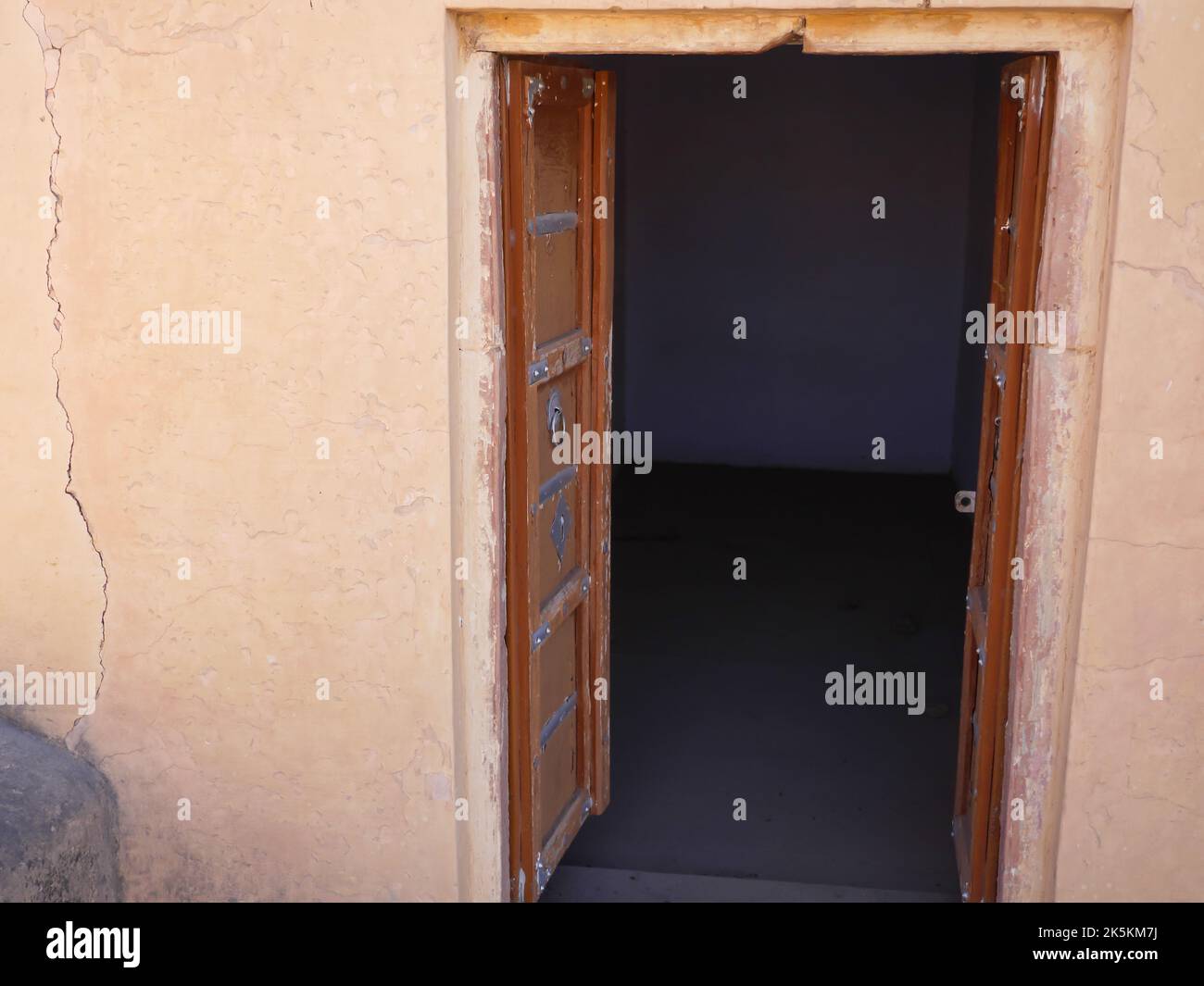 Old Wooden Door in ruined fort in India. Old traditional wooden door in fort. Stock Photo